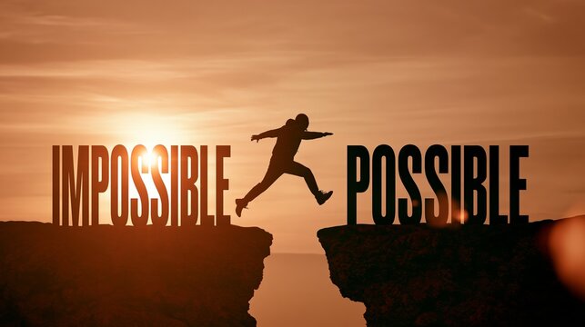 Person silhouette jumping from IMPOSSIBLE to POSSIBLE word across cliff gap during sunset, overcoming challenge