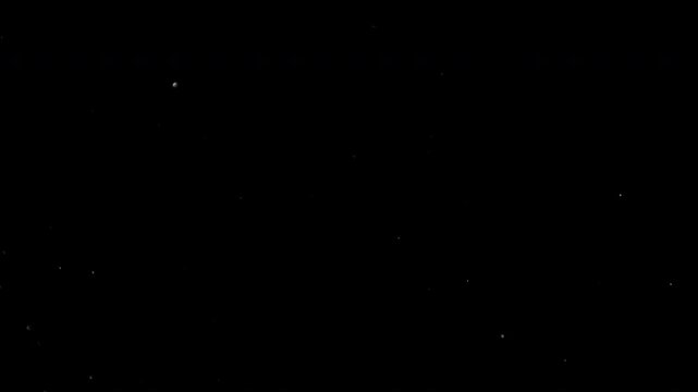 Super slow motion video at 1000 fps showing tiny particles floating and moving through the air against a black background, revealing intricate motion and atmospheric detail.