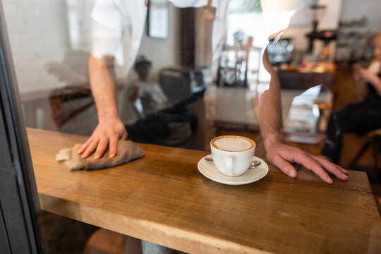 Coffee shop cleaning in progress.
