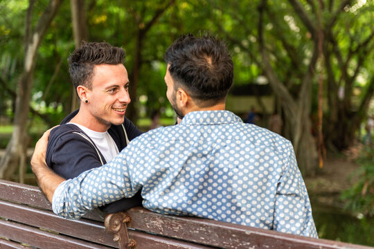 Couple enjoying park bench photo