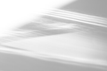 Fototapeta na wymiar Real sharp horizontal caustic shadow cut out on a transparent png background with wavy organic bands. Suits architectural and minimal fashion workflow as a transparent png overlay layer.
