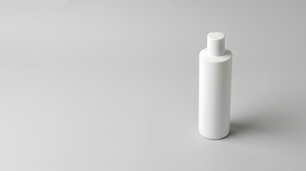 A white plastic cosmetic bottle mockup standing upright in minimal studio lighting © ChaohM