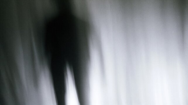 The Shadowy Figure in Motion Blur Amid Dim Vertical Light Strips