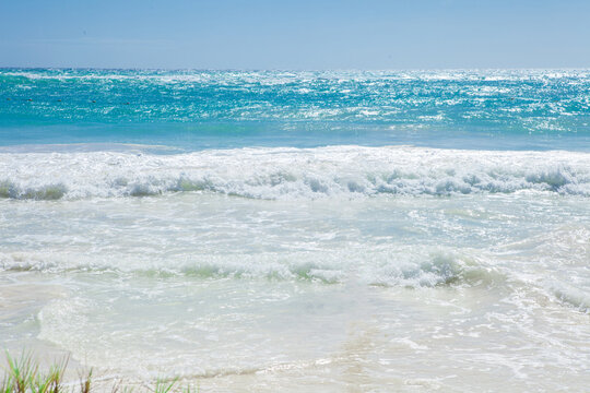 Turquoise Caribbean Sea with White Sand and Gentle Ocean Waves