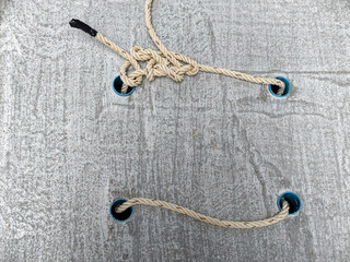 rope on wood as background © Saravut