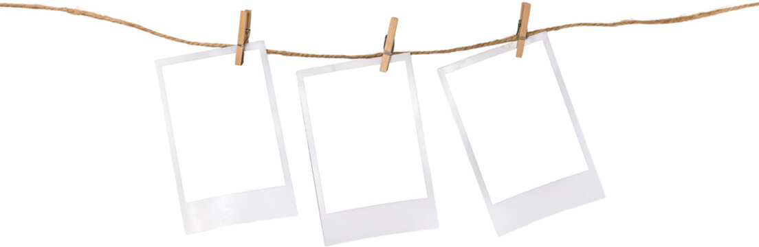 White Vintage Blank Paper Polaroid Frames Hanging On A Rope