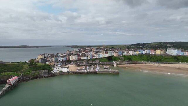 Aerial Drone View of Tenby Peninsula Coastal Town and Sandy Beach in Pembrokeshire Wales UK