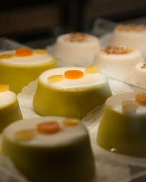 Cassatina siciliana, a traditional individual pastry from Sicilian confectionery consisting of a small dome of sponge cake covered in green marzipan.