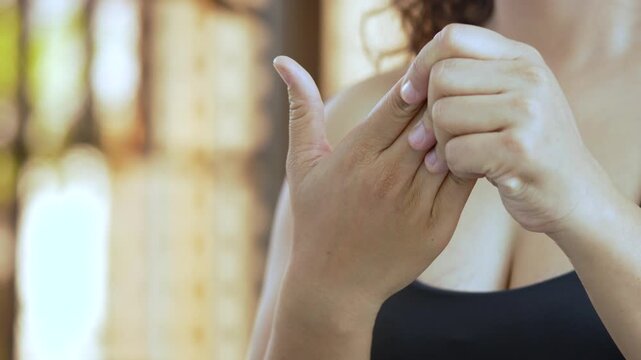 women holds his wrist. hand injury, feeling pain. Health care and medical concept. and those with a family history of degenerative knuckles.