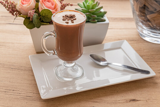 Hot chocolate drink served on wooden table