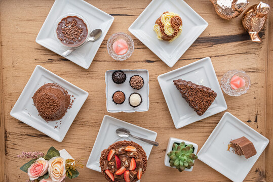 Overhead shot shows Assorted brazillian desserts on table