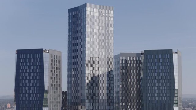 Establishing aerial view of Manchester, United Kingdom. Modern skyline of sprawling metropolis in the North of England