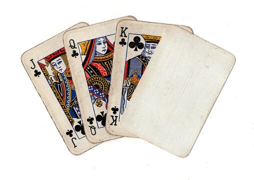 A hand of grubby old vintage playing cards with one blank card for text or copy isolated on a white background.