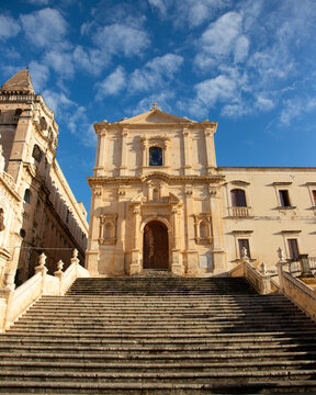 Noto, Italy; 1st October 2026: Piazza Immacolata with the Church of Saint Francis of Assisi and the old convent on the left.