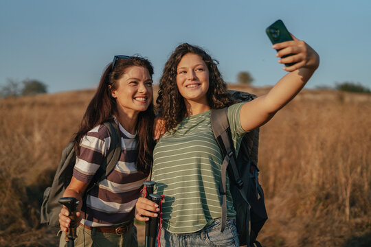 Friends hiking together taking a selfie outdoors