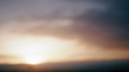 Obraz premium The Blurred Sunset Over A Quiet Horizon At Dusk And Mist