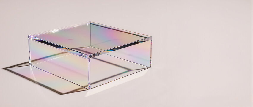 Translucent acrylic platform with iridescent refractions. Clear glass podium casting colorful rainbow shadows on a pale background
