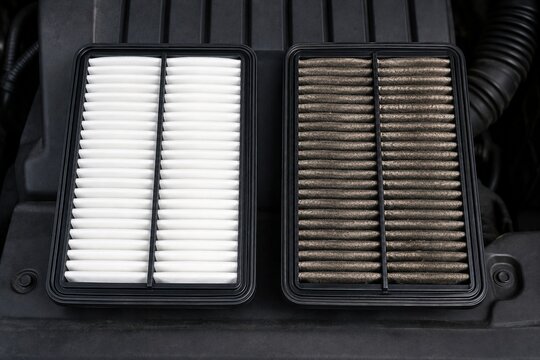 Clean and dirty automotive air filters compared during routine vehicle maintenance service