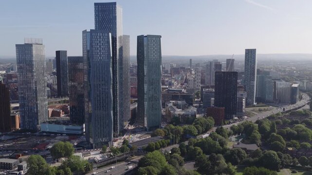 Establishing aerial view of Manchester, United Kingdom. Modern skyline of sprawling metropolis in the North of England