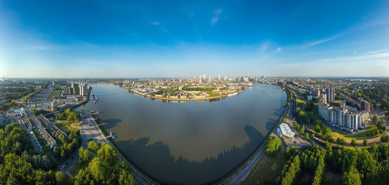 Aerial panorama of Rotterdam city and Nieuwe Maas river