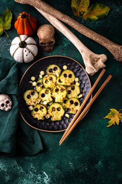 Halloween food. Asian style marinated cucumber in shape of skull