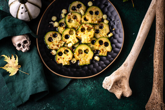 Halloween food. Asian style marinated cucumber in shape of skull
