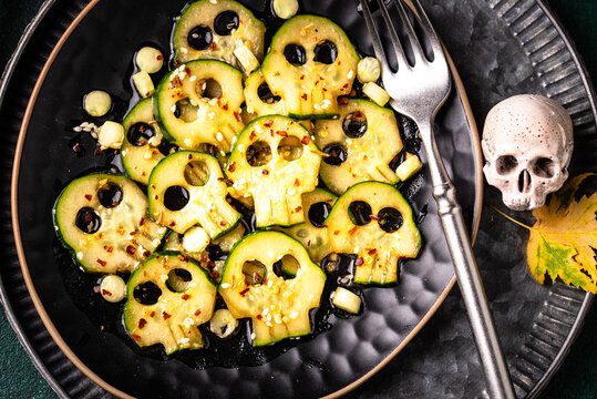 Halloween food. Asian style marinated cucumber in shape of skull