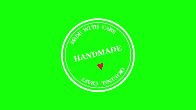 Handmade stamp green screen video element, rotating round white seal with text and red heart graphic, chroma key background overlay, craft and diy packaging concept