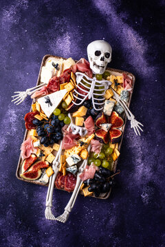 Halloween charcuterie board with cheese salami and appetizers