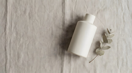 Obraz premium Cosmetic bottle with eucalyptus leaf.