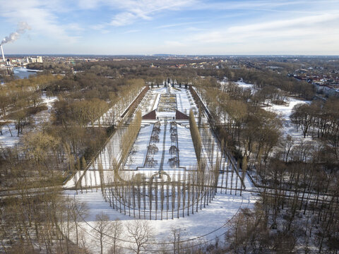 Aerial view of the Soviet War Memorial in Treptower Park, featuring snow-covered pathways, rows of bare trees, and the central monument in a winter landscape in Berlin, Berlin, Germany.