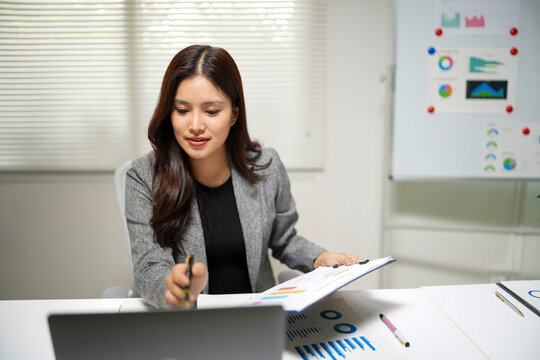 Business professional analyzing financial reports and data presentations for marketing strategies and remote work meetings