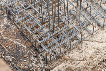 Obraz premium Construction site reveals intricate detail of excavation pit and steel reinforcement ready for new foundation laying