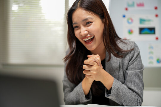 Successful Businesswoman Reacting with Surprise in Office