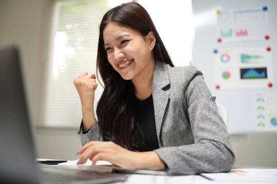 Successful Businesswoman Celebrating a Surprise at Work