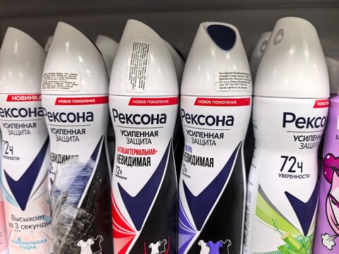 Different varieties of deodorant showcasing vibrant packaging in a store
