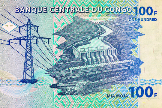 100 Congolese Francs banknote featuring Inga II hydroelectric dam and high-voltage power transmission tower. Currency of the Democratic Republic of the Congo. Money of Africa.