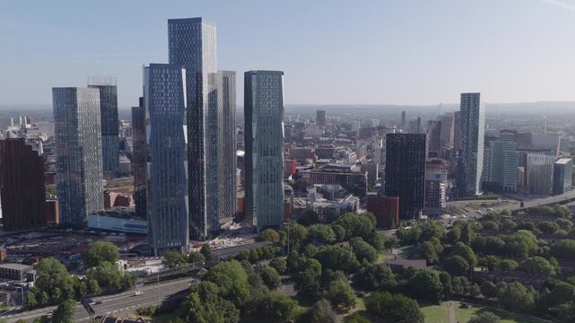 Establishing aerial view of Manchester, United Kingdom. Modern skyline of sprawling metropolis in the North of England