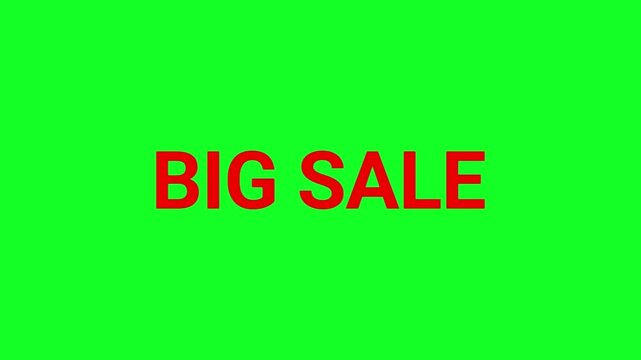 Big sale sign features bold red typography placed on a flat green surface to highlight major retail pricing reductions.