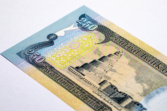 250 Dinars Iraqi banknote bill featuring the Great Mosque of Samarra spiral minaret - Malwiya Tower. national currency of Iraq. Pennies to the world