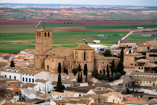 Historic Collegiate Church of San Bartolom&eacute; in Belmonte surrounded by traditional houses, Spain