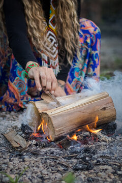 Sao Paulo, SP, Brazil - November 17 2024: Close-up of female hands lighting a fire details.