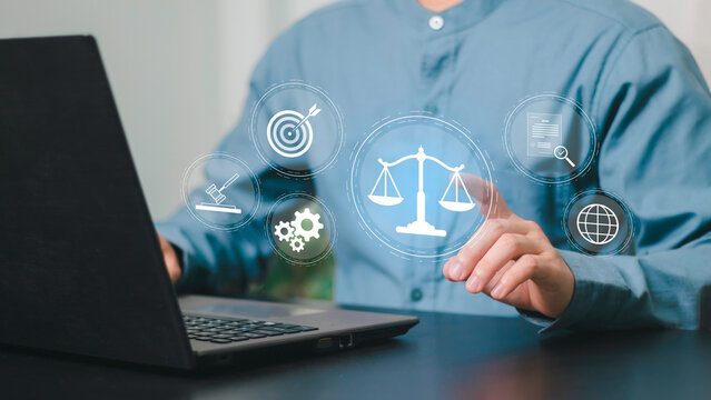 Legal ethics, compliance, regulation, business law and corporate governance. Businessman touching legal information on a laptop with digital law and search interface.
