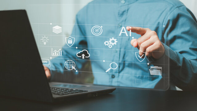 AI strategy, digital transformation, business goals, innovation and technology. Business professional using a laptop with artificial intelligence, target, analytics, cloud and security icons
