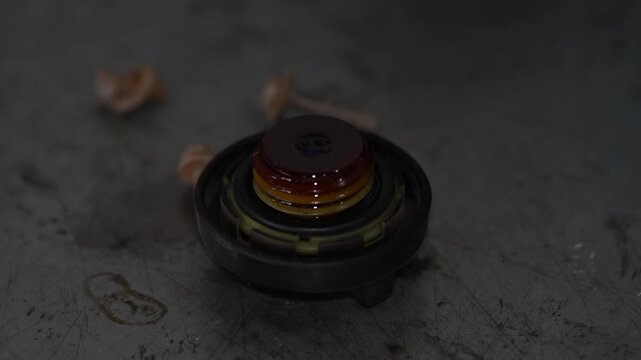 Close up shot of dirty car engine oil filler cap.