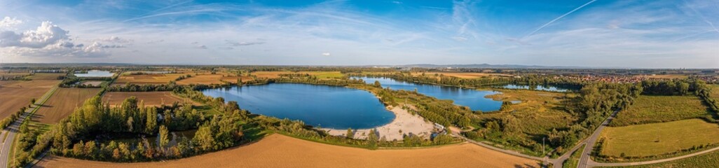 Fototapeta premium Bird's-eye view of the Lake Altrhein with its bathing beach near Eich in Rhineland-Palatinate