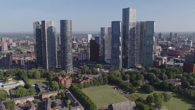Establishing aerial view of Manchester, United Kingdom. Modern skyline of sprawling metropolis in the North of England