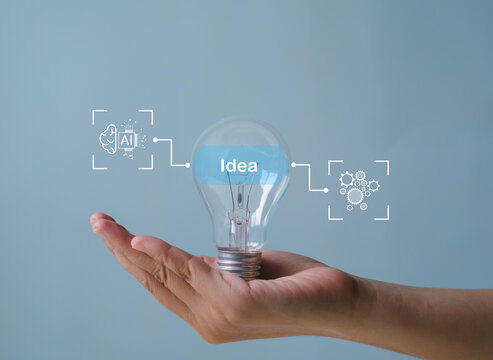 New business ideas and strategic consulting. Mobile wooden block with light bulb icon. Brainstorming creativity and expertise.