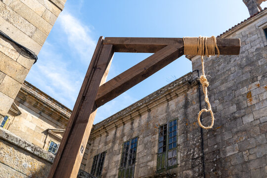 Low Angle Shot of Wooden Gallows Structure Against Blue Sky