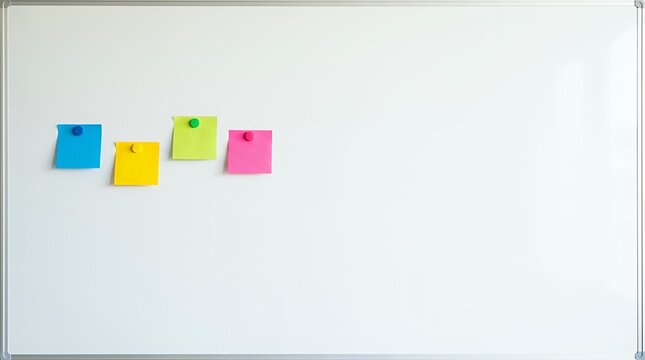Four vibrant sticky notes in different colors attached to a white magnetic board ready for collaborative brainstorming sessions team reminders and creative idea generation four sticky notes vibrant